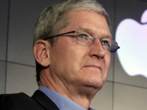 Tim Cook in front of an Apple Logo