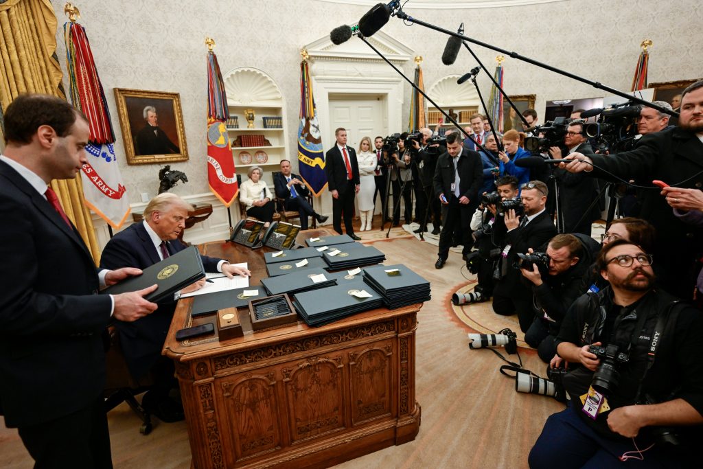 Donald Trump signing executive orders as 47th President of the United States