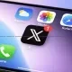 X app icon with a notification, displayed on an iOS app screen